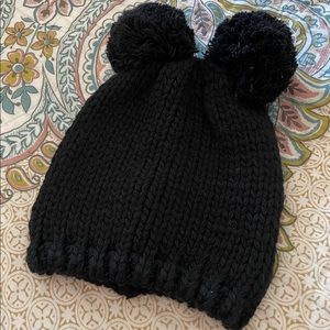 Black knit hat with double pom pom